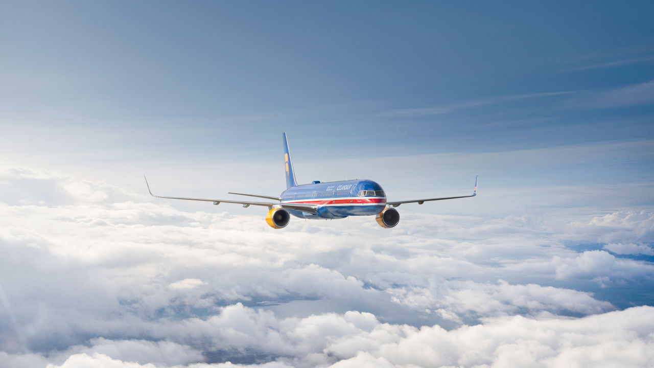 An airplane flying above the clouds